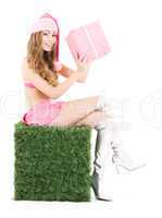 santa helper with gift box on green cube