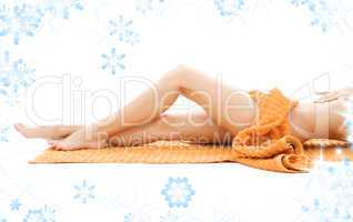 long legs of relaxed lady with orange towel