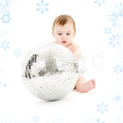 adorable baby boy with big disco ball