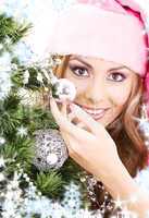 santa helper girl decorating christmas tree