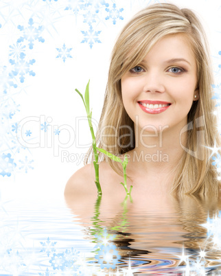 blue-eyed blonde with bamboo in water