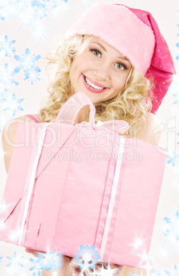 cheerful santa helper girl with gift box