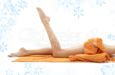 legs of relaxed lady with orange towel