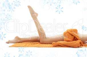 legs of relaxed lady with orange towel