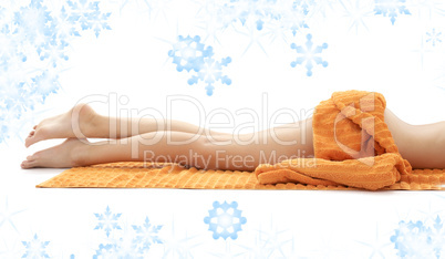 legs of relaxed lady with orange towel