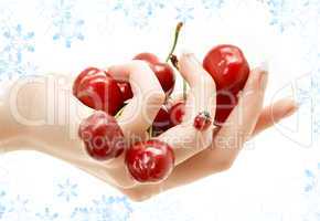 hand full of red cherries