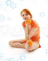 cheerful redhead with two oranges