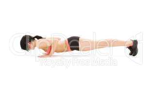 woman practicing four-limbed staff pose