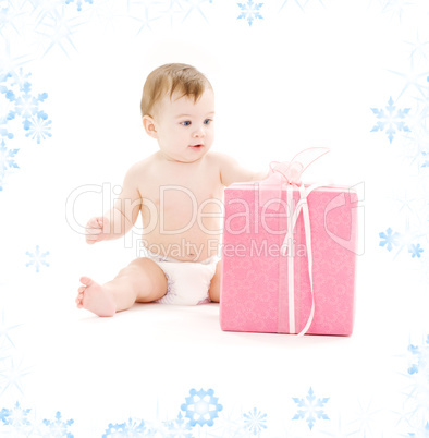 baby boy in diaper with big gift box