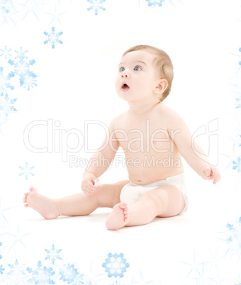 baby boy in diaper with toothbrush