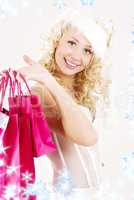 cheerful santa helper girl with shopping bags