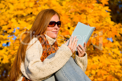 Autumn sunset country - woman read book