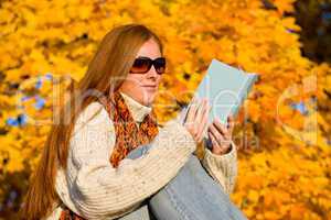 Autumn sunset country - woman read book