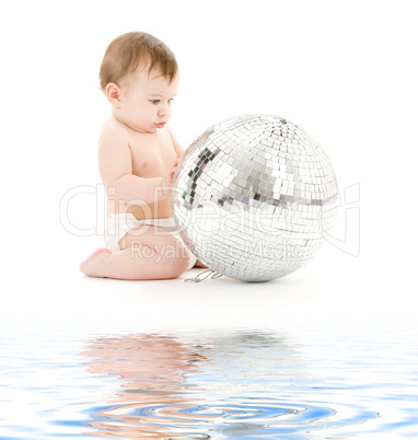 adorable baby boy with big disco ball