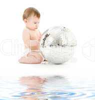 adorable baby boy with big disco ball