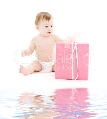 baby boy in diaper with big gift box