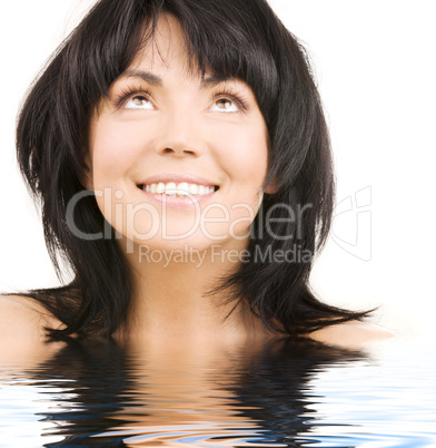 happy woman looking up in water