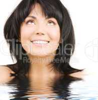 happy woman looking up in water