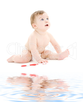baby boy in diaper with toothbrush baby boy in diaper with toothbrush