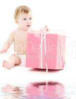 baby boy in diaper with big gift box