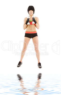 muscular fitness instructor with dumbbells