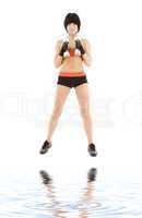 muscular fitness instructor with dumbbells