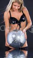 party dancer in black lingerie with disco ball