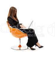 businesswoman in chair with laptop