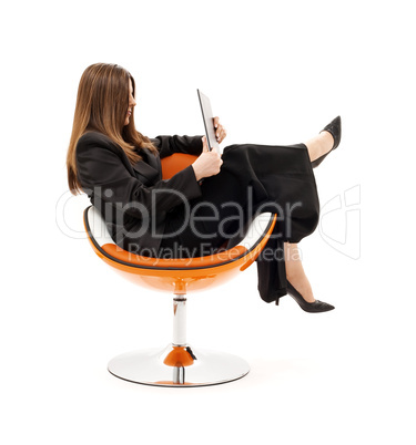 businesswoman in chair with laptop