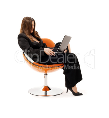 businesswoman in chair with laptop