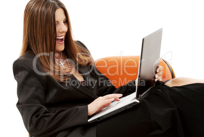 businesswoman in chair with laptop