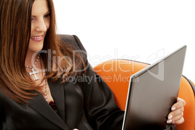 businesswoman in chair with laptop