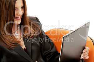 businesswoman in chair with laptop