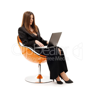 businesswoman in chair with laptop