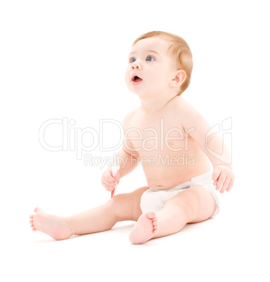 baby boy in diaper with toothbrush baby boy in diaper with toothbrush