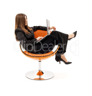 businesswoman in chair with laptop