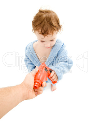 baby boy with toy drill