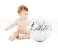 adorable baby boy with big disco ball