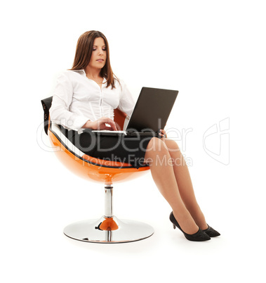 businesswoman in chair with laptop