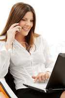 businesswoman in chair with laptop and phone