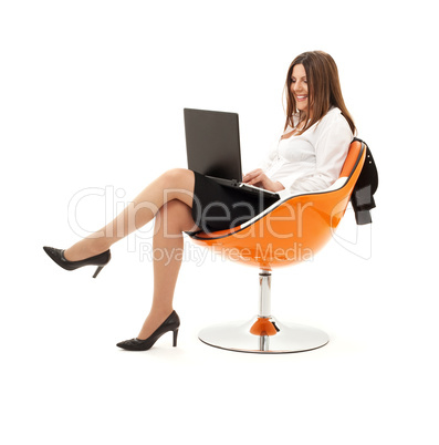 businesswoman in chair with laptop