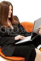 businesswoman in chair with laptop