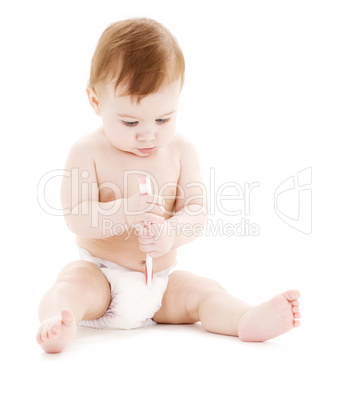 baby boy in diaper with toothbrush