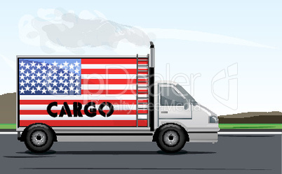 cargo truck on road with american flag