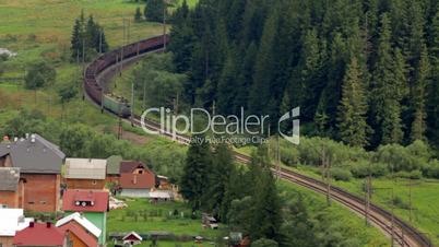 Freight train rides through the forest time lapse