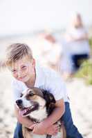 Handsome Young Boy Playing with His Dog
