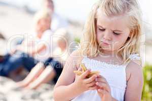 Adorable Little Blonde Girl with Starfish