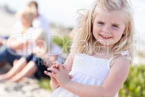 Adorable Little Blonde Girl Having Fun At the Beach