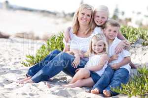 Attractive Mom and Her Cute Children at The Beach