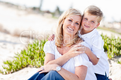 Cute Son Hugs His Mom at The Beach